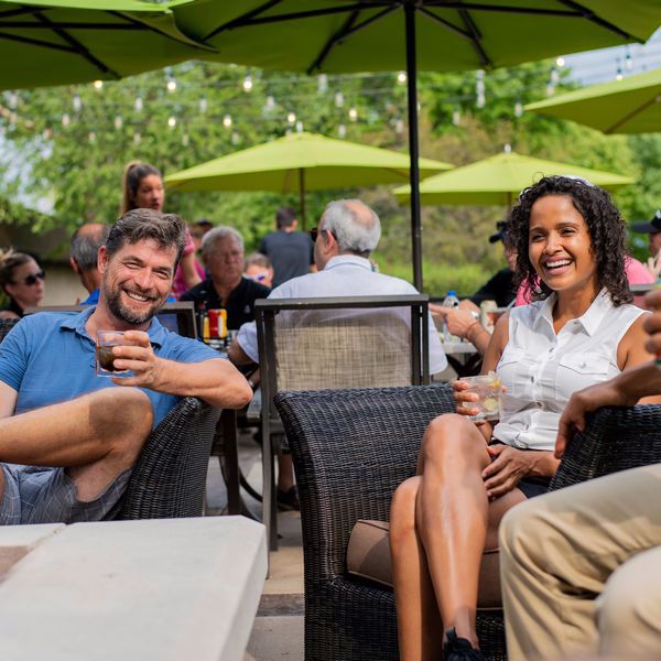 Couple on Links Patio enjoying coctails